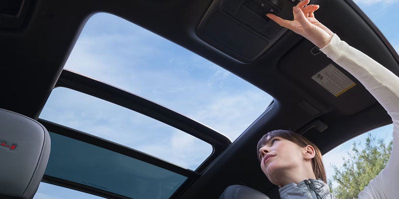 2026 GMC Acadia interior technology in Garden City Park NY with 15-inch infotainment screen, Google built-in, and wireless Apple CarPlay
