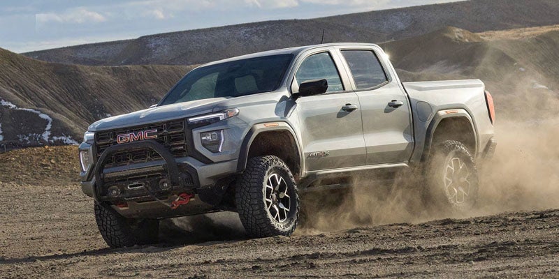 2026 GMC Canyon trim lineup Elevation AT4 AT4X and Denali displayed at dealership in Garden City Park NY